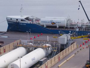 Tanker being fueled with LNG from shore