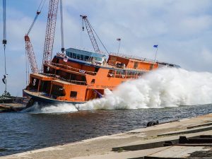 Splashy side launch of yellow Staten Island ferry