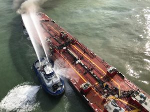 Fireboat tackles barge fire