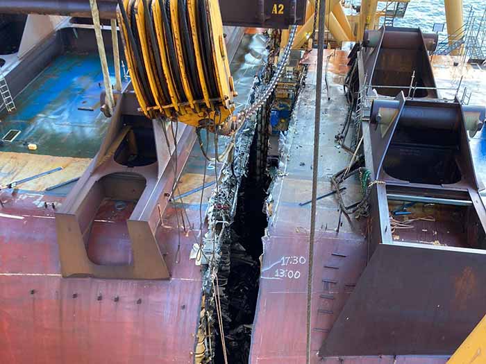 Deep groove between sections of wreck