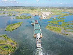 Tug pushing barges