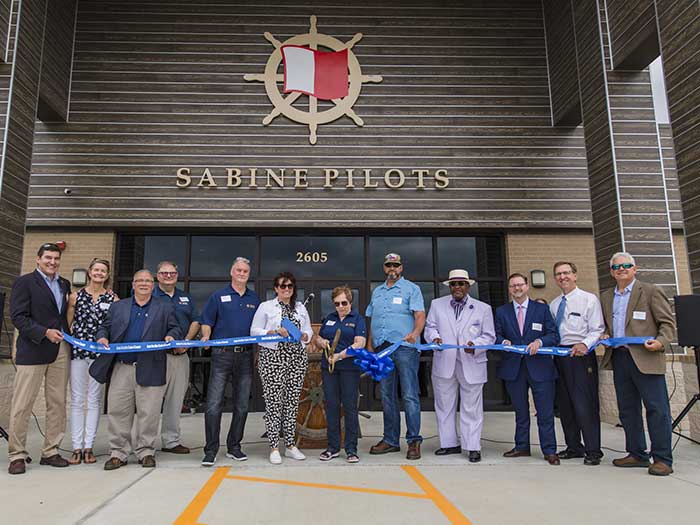 Group assembled for ribbon cutting of new pilot headquRTERS