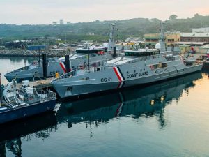 Two patrol boats alongside at shipyard