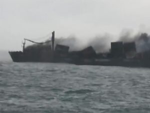 Smoke billows from wreck