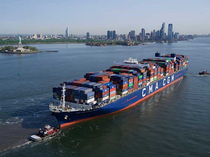 CMA CGM Marco Polo with tugboats