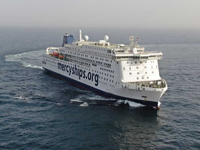 White hospital ship at sea