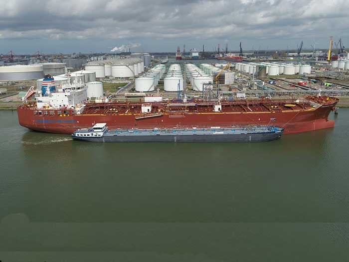 Barge in front of methanol carrier