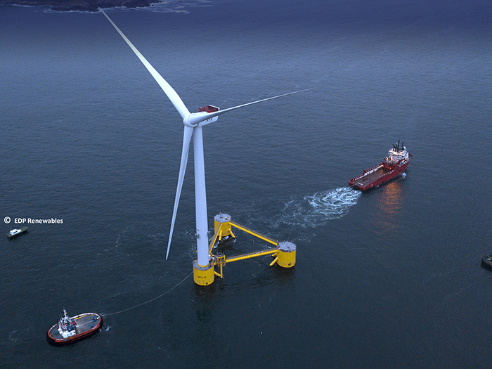 Boat approaching floating wind turbine