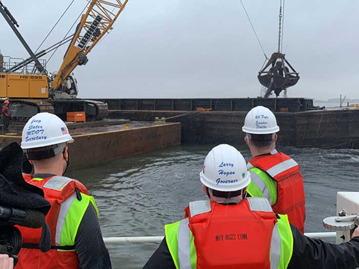 Officials observe dredging activity