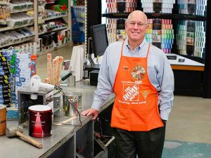 Home Depot's Ted Decker in orange apron