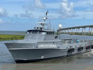 Vessel is boldly labeled Jones Act Enforcer