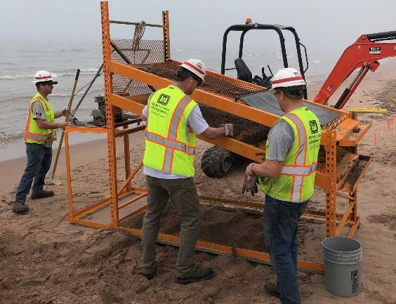 U.S Army Corps of Engineers, Duluth Area Office Floating Plant crew designed and fabricated a screening machine to filter the debris from the beach on Minnesota Point.