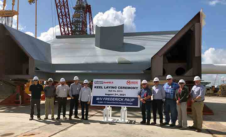 Group of executives at keel layingv ceremony for new dredge