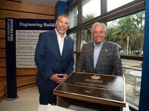 Donald T. “Boysie” Bollinger (R) and UNO President John Nicklow with plaque bearing new name of university's School of Naval Architecture & Marine .Engineering,