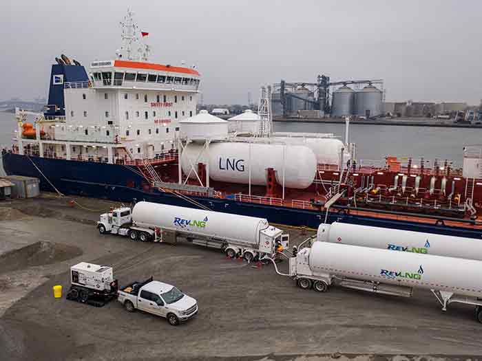 Vessel being bunkered with LNG by tanker trucks