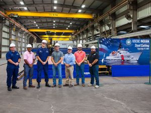 USCG and ESG personnel at steel cutting ceremony
