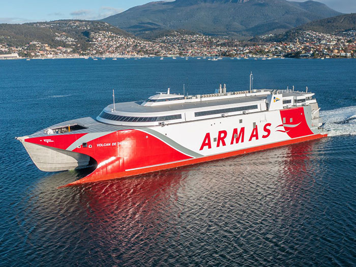 Red and white high speed catamaran ferry.