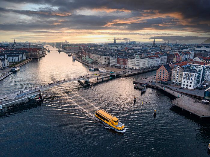 Ferry sailing under bridge