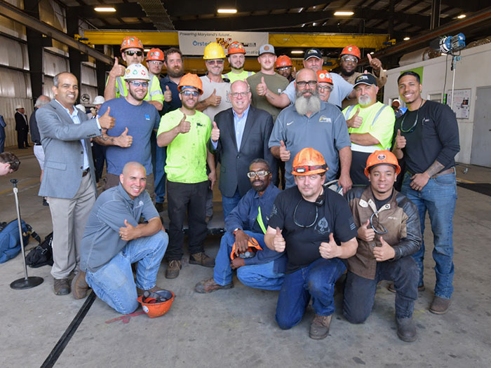 Marcland governor with Crystal steel workers