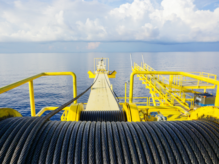 A steel wire rope drum on a crane offshore wellhead platform.