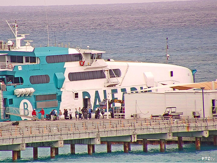 Cruise ship passengers transfer to ferry