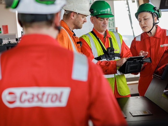 Castrol people in Castrol hats