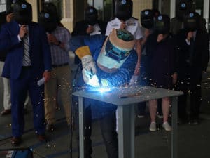 Welder welds plate for oceanographic research ship