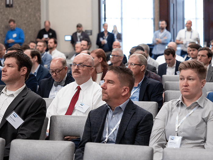 Audience members look on during a presentation at TTB 2023 in Mobile.