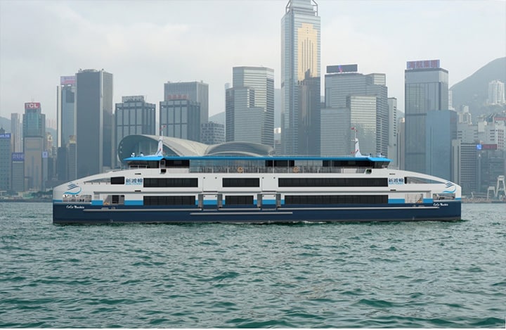 Double-ended ferry seen with Hong King skyline