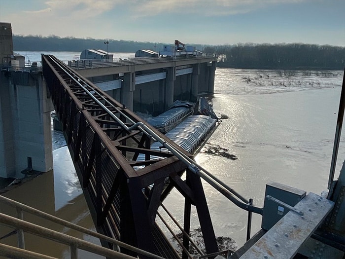 Kentucky Emergency and Environment Cabinet (EEC) tweeted this photo of breakaway barges piled against dam.