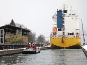 The M/V Happy Rover and tug Wyoming enter the Soo Locks' MacArthur Lock in Sault Ste. Marie, Michigan heading to Lake Superior.