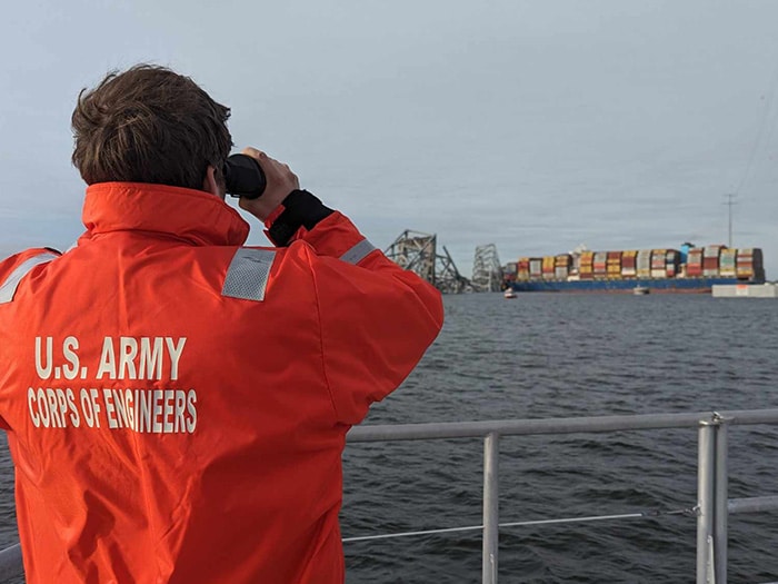U.S. Army Corps of Engineers staff onboard hydrographic survey vessel Catlett observe the damage resulting from the collapse of the Francis Scott Key Bridge in Baltimore, March 26, 2024.