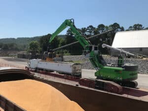 Sennebogen material handler loading barge