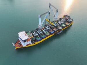 11 tugs atop one BigLift vessel