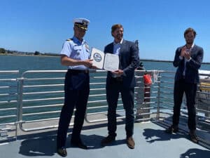 Captain Taylor Q. Lam presents Pace Ralli, CEO of SWITCH Maritime, with signed Certificate of Inspection