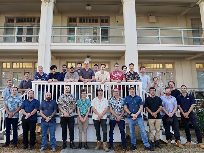 Twenty-eight ASC personnel pose for a photo at Pearl Harbor Naval Shipyard and Intermediate Maintenance Facility (PHNSY & IMF), Joint Base Pearl Harbor-Hickam, Hawaii.