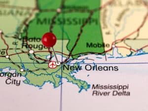 The Coast Guard responded to a vessel collision that resulted in a barge breakaway and one sunken barge on the near New Orleans.