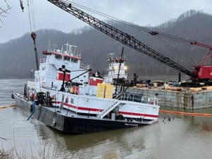 Tom Frazier aground and listing to starboard on Feb. 11, 2024. [Photo: U.S. Coast Guard]