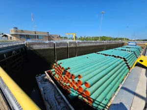 A barge transporting piping passes through the Old Hickory Lock on Thursday, Aug. 22, 2025. The lock, located on the Cumberland River, supports commercial navigation in the region