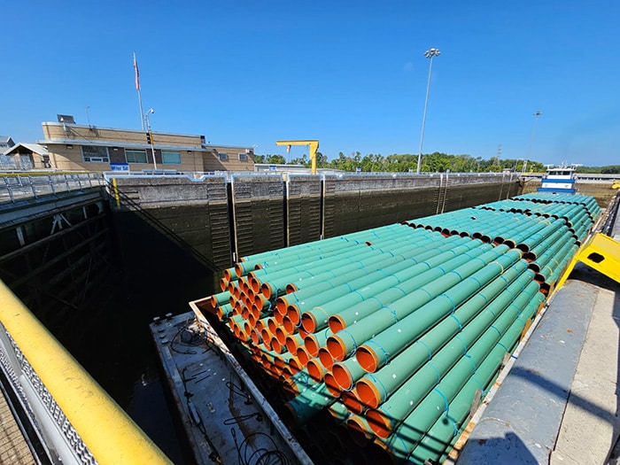 A barge transporting piping passes through the Old Hickory Lock on Thursday, Aug. 22, 2025. The lock, located on the Cumberland River, supports commercial navigation in the region