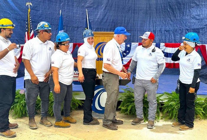 Johnny Conrad congratulates Amelia employeers