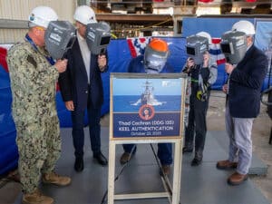 L to R: US Navy Commanding Officer Supervisor of Shipbuilding Gulf Coast, Captain Randy Staff, Ingalls Shipbuilding VP programs, George Nungesser; Ingalls Shipbuilding structural welder Thomas Ward, Ingalls shipbuilding president Brian Blanchette; and ship sponsor Kay Bowen Webber Cochran. [Photo: HII]