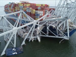 The containership Dali with portions of the collapsed Francis Scott Key Bridge across its forward deck on March 28, 2024. (Source: NTSB)