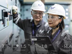 Two people in Accelleron hard hats