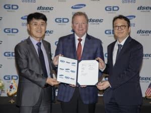 L to R: Mr. Seogyong (SY) Youn, DSEC president; Dave Carver, NASSCO president; Mr. Joonyun Kang, Samsung director of the eco business team. [Photo: GD NASSCO]