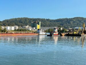 A barge passes through the newly-opened navigation channel at Lock and Dam 3.