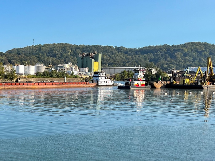 A barge passes through the newly-opened navigation channel at Lock and Dam 3.