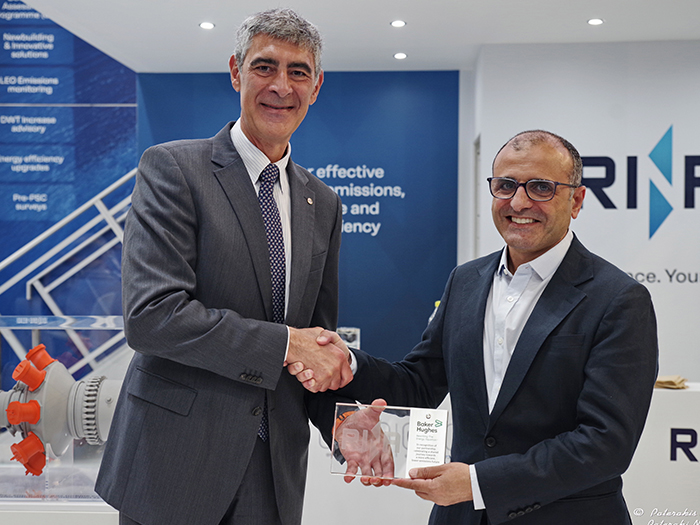 L to R: Giosuè Vezzuto, marine executive VP at RINA, hands NovaLT TA certificate to Ahmed Eldemerdash, VP climate technology solutions at Baker Hughes. [Photo: Baker Hughes]
